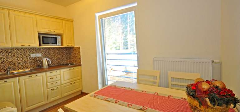 V apartmáne Bartek Ski Rental sa nachádza kuchynka 