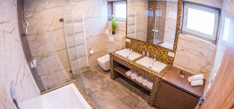 Kúpeľňa je rovnako štýlová ako celý apartmán