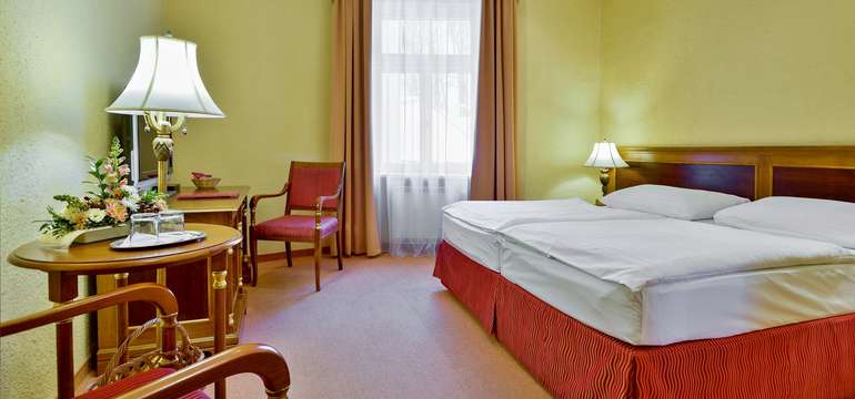 Ve všech pokojích najdete pohodlí čtyřhvězdičkového hotelu